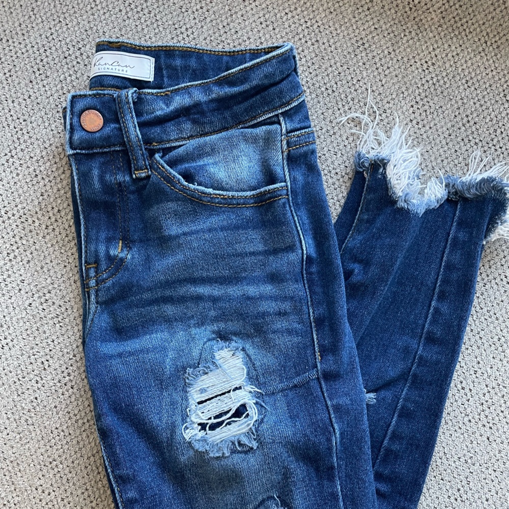 Girls KanCan distressed skinny jeans.